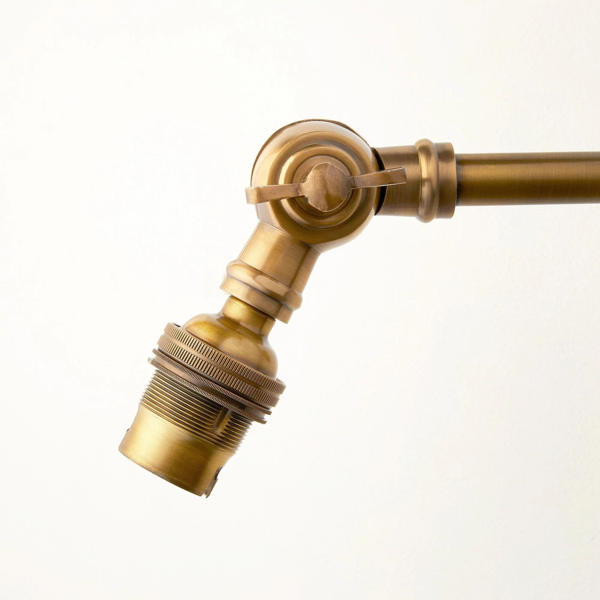 Double jointed wall fitting in antiqued brass - Image 2