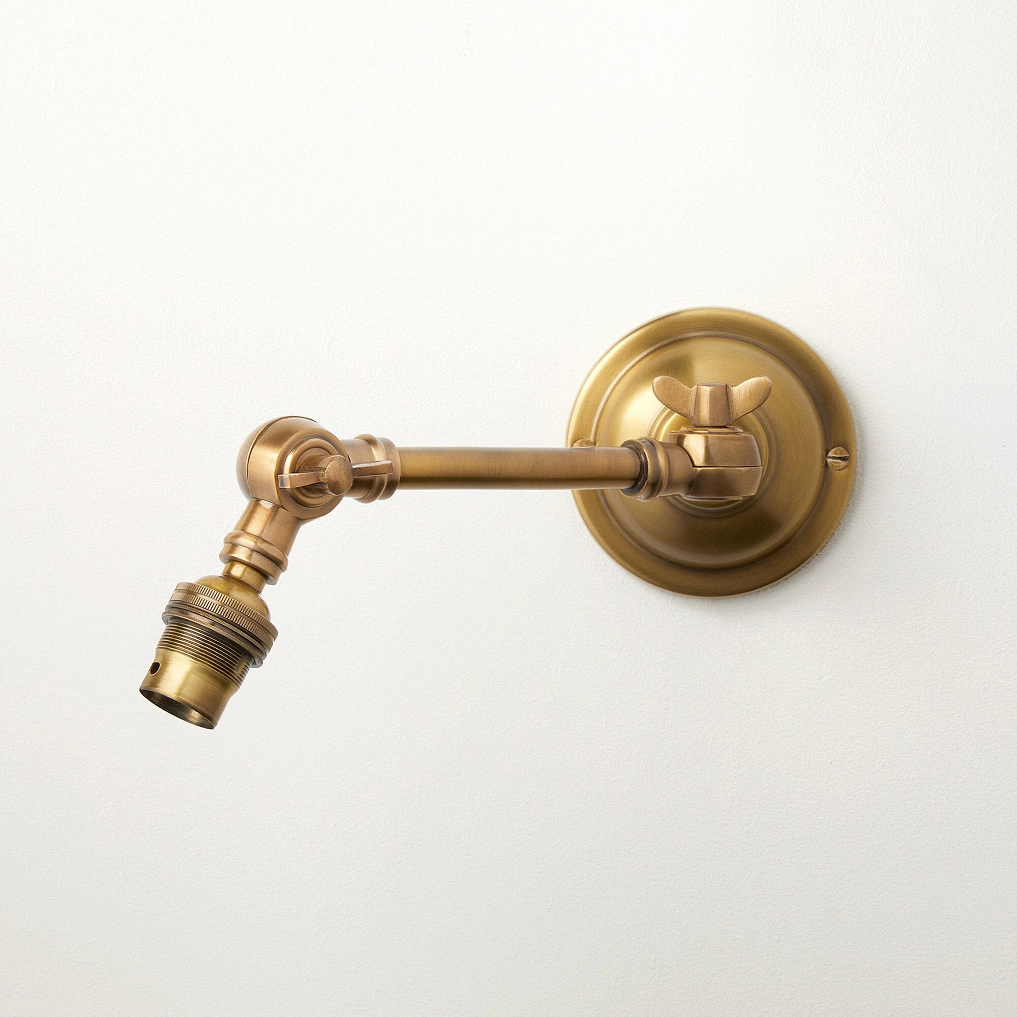 Double jointed wall fitting in antiqued brass - Image 4