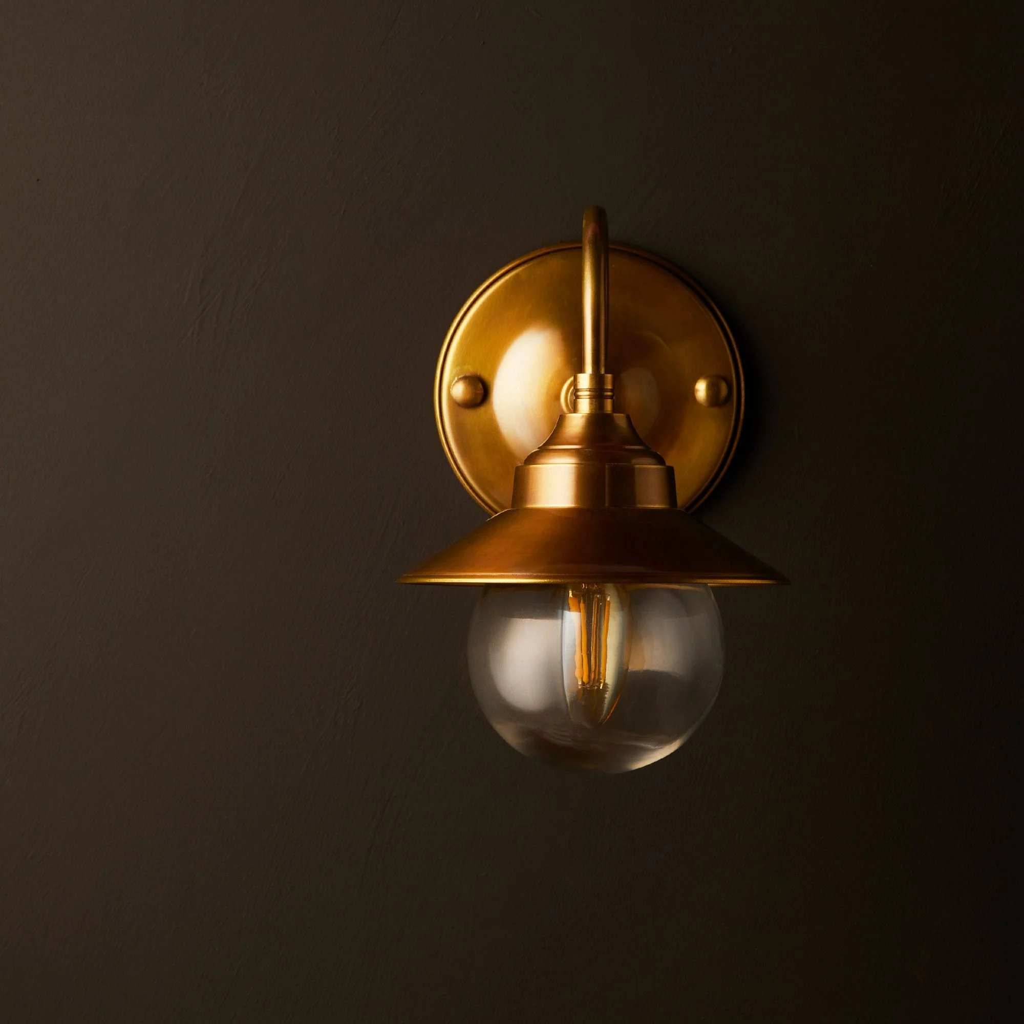 Goliath IP44 wall light in antiqued brass and glass with hat - Image 5