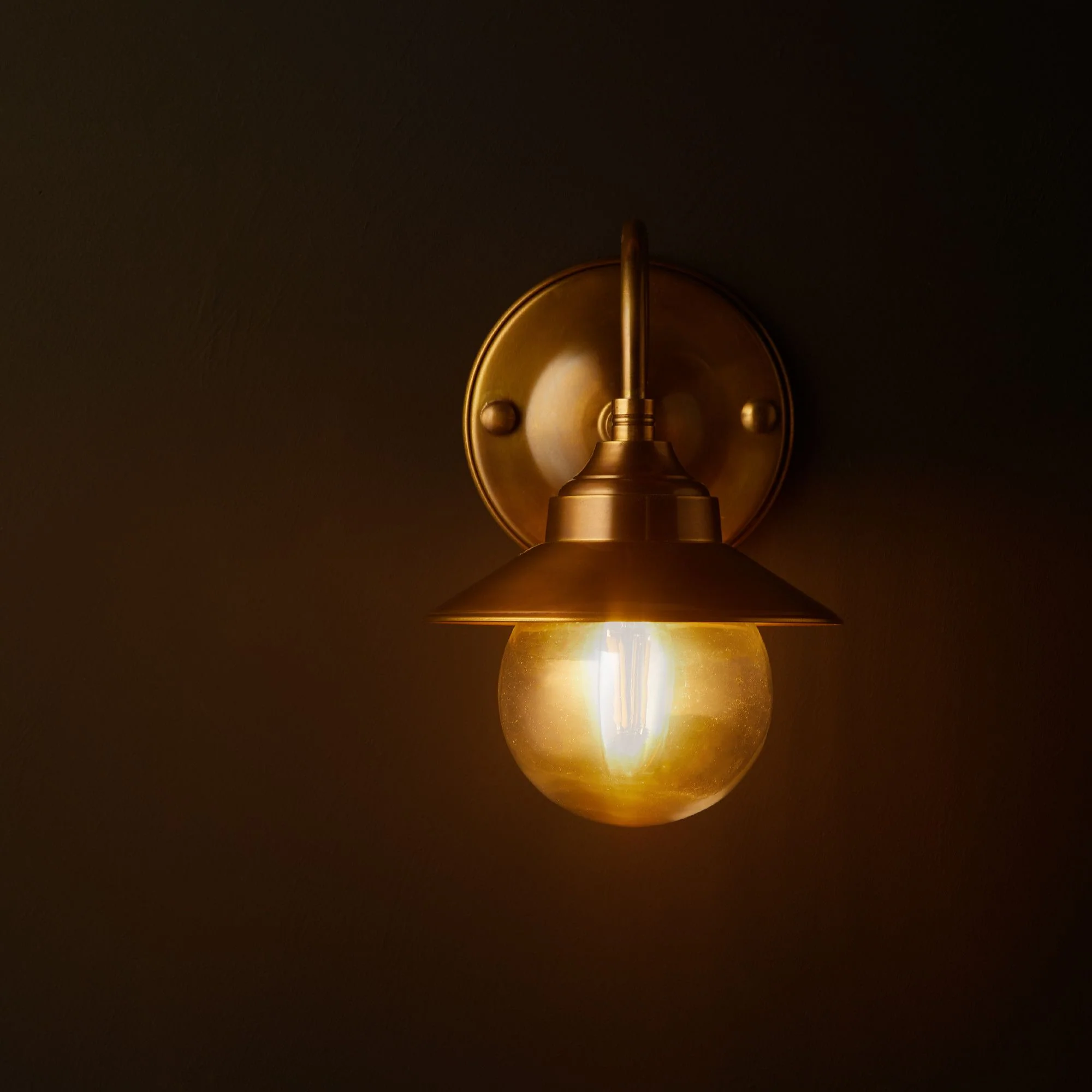Goliath IP44 wall light in antiqued brass and glass with hat - Image 7