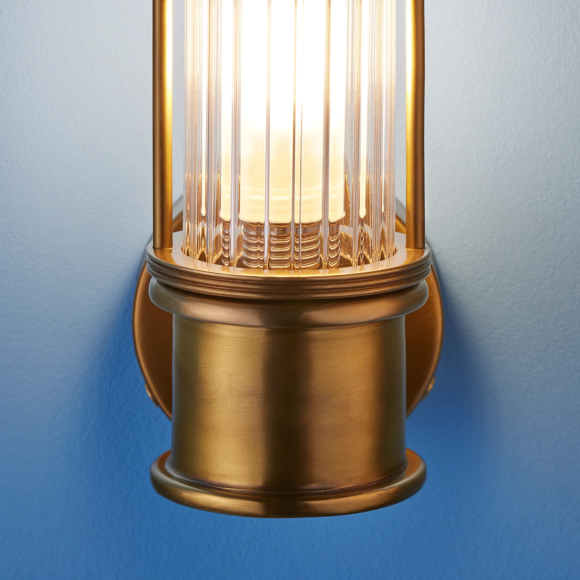 Smaller Hunter IP44 rated wall light in brass and glass - Image 10