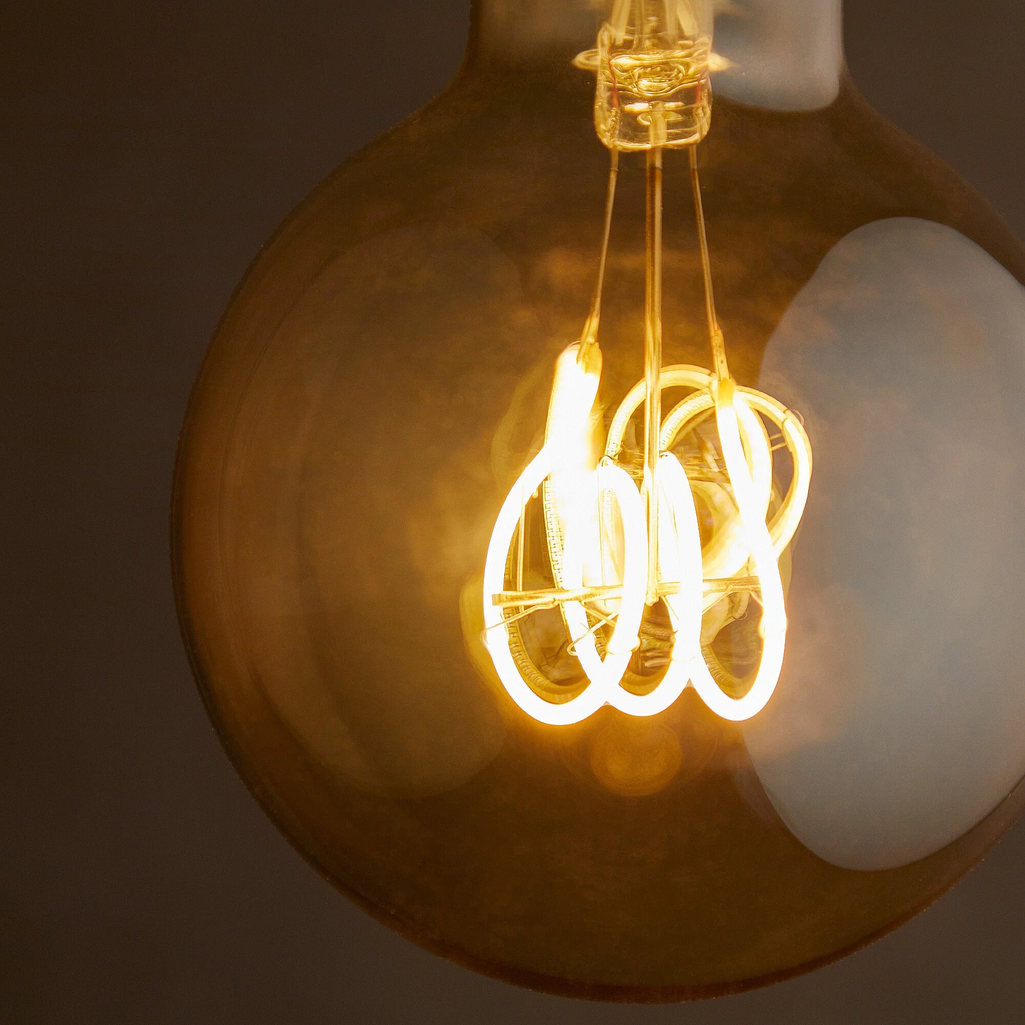 Large globe 4 watt LED Edison style filament bulb with amber coating and E27 fitting - Image 4