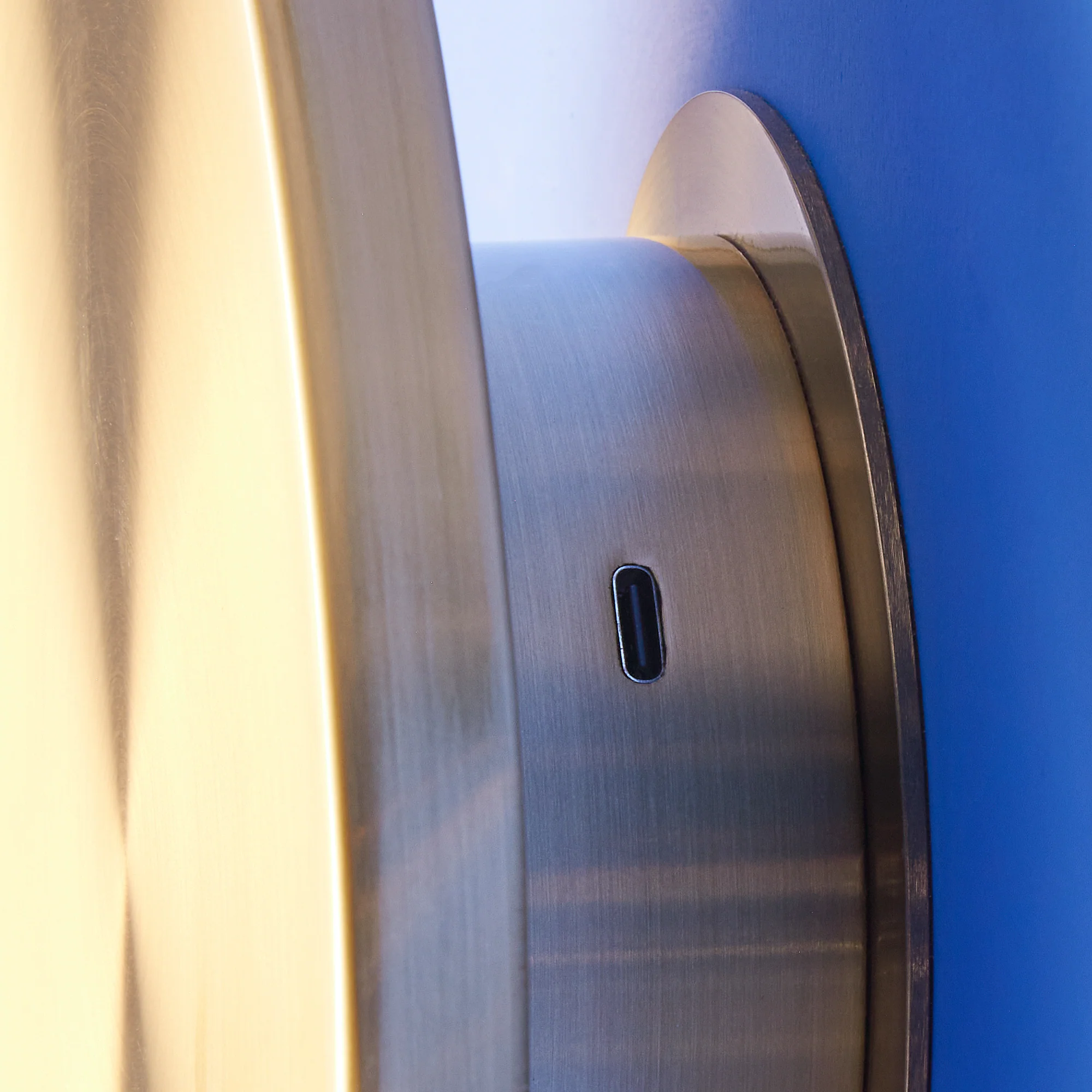 Larger Helios rechargeable wall light in brushed gold aluminium - Image 6