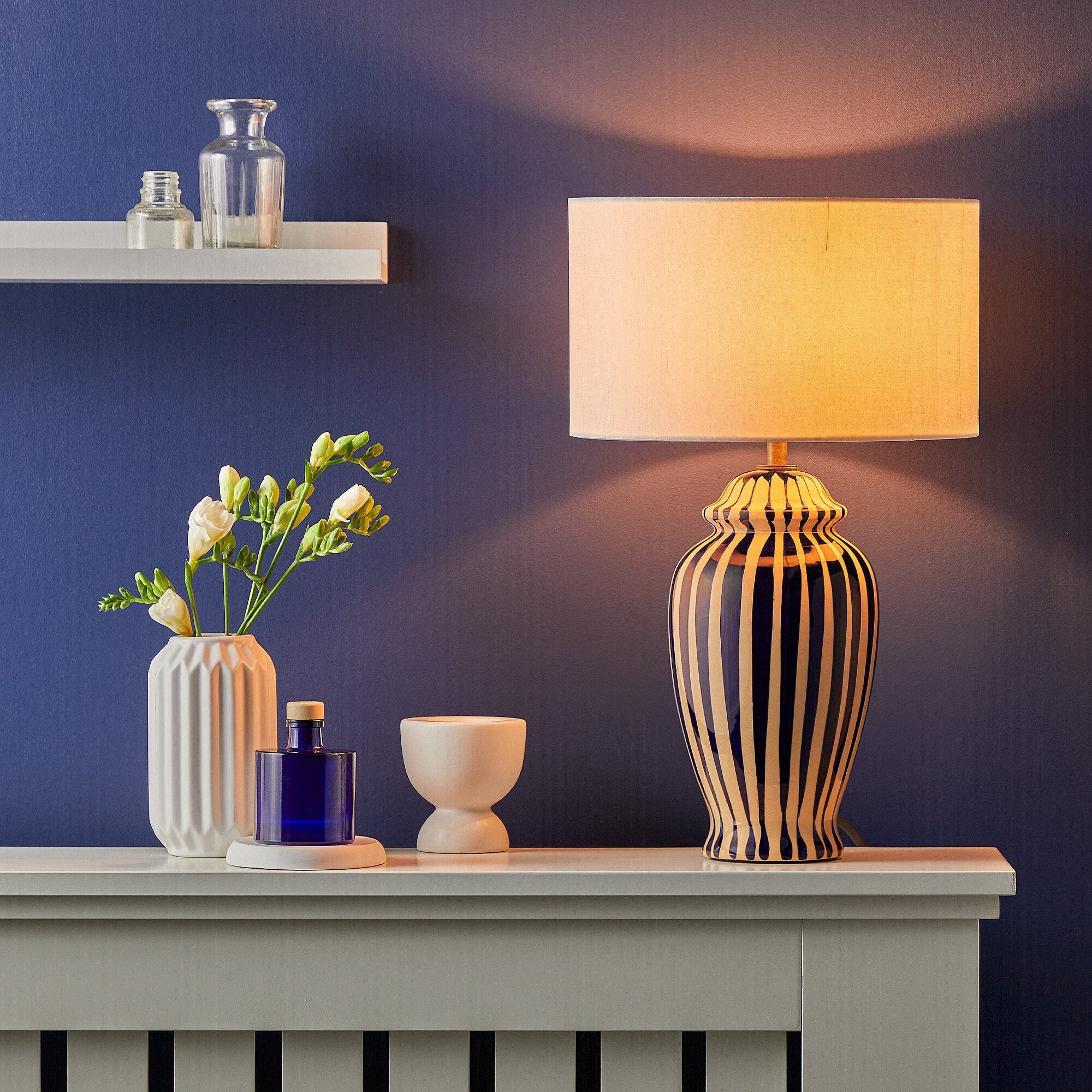 Smaller Lottie bedside lamp in a cobalt blue and stone glaze - Image 6