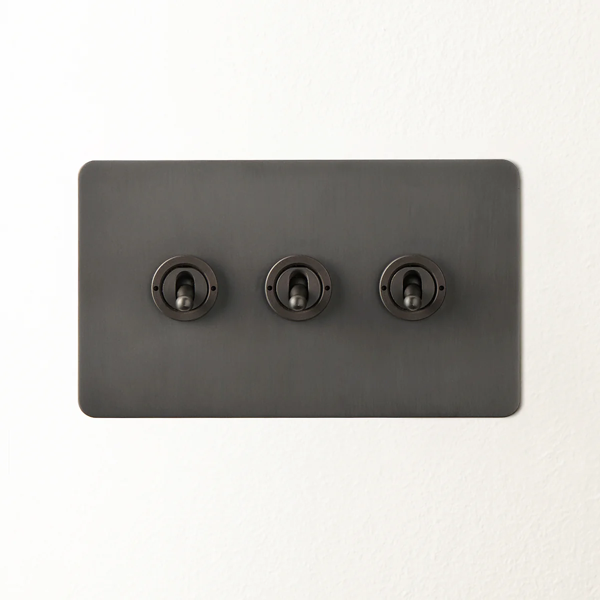 Lucian three gang 2 way toggle switch in bronze