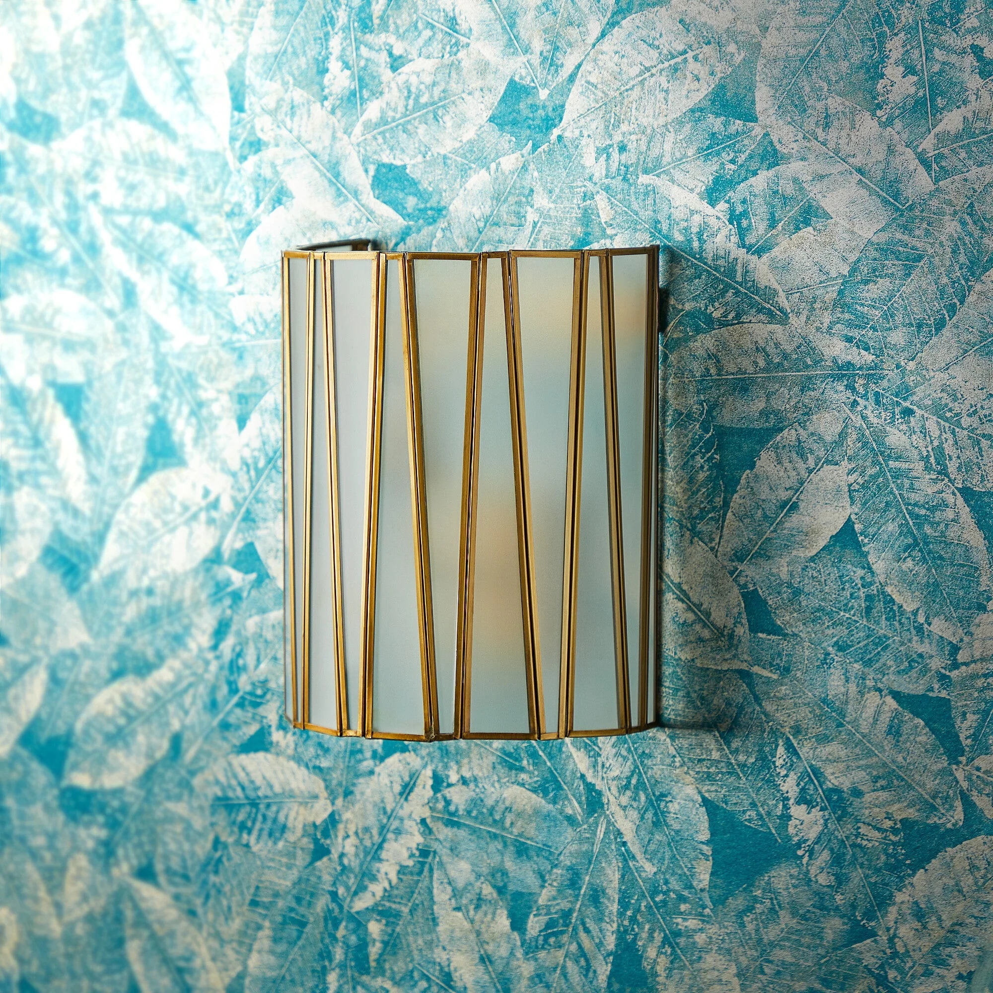Shard wall light in brass and frosted glass